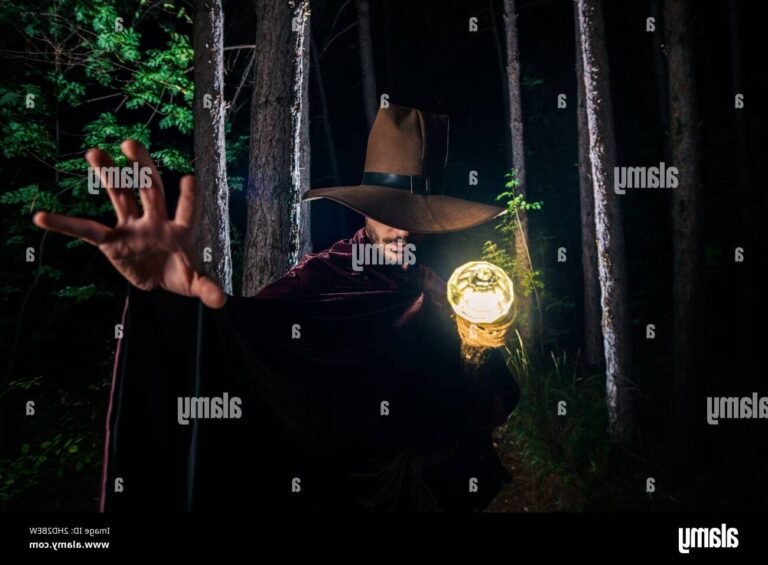 baguette magique illuminee dans une foret sombre